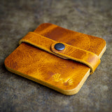 handcrafted tan leather coaster set
