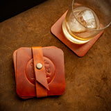 handcrafted full grain and vegetable tanned leather coaster set with scottish thistle